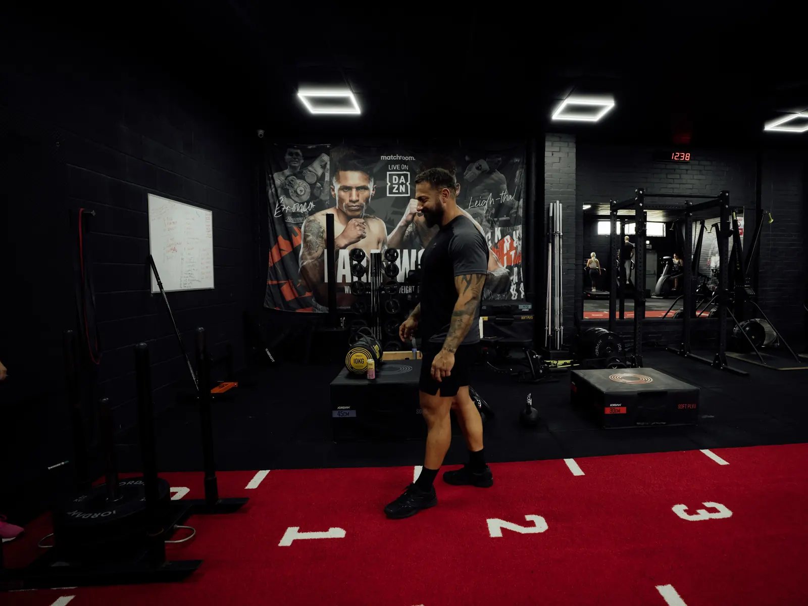 A coach walking the training floor at a gym in Wisbech